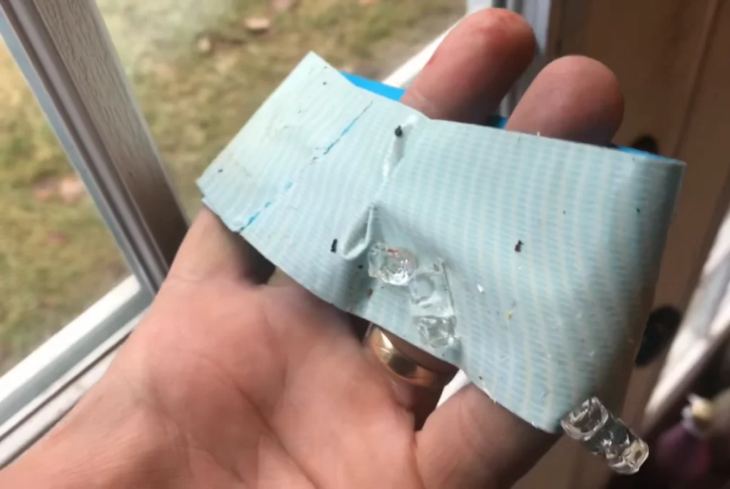 Picking up broken glass with duct tape